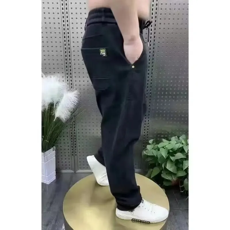 Harajuku Stretch Korea Streetwear רופף ג'ינס ג'ינס מוצק מותן אלסטי לגברים אביב קיץ חדש פלוס מידה 7XL 8XL מכנסיים מזדמנים