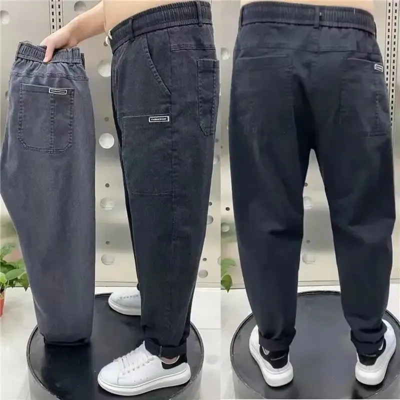 Harajuku Stretch Korea Streetwear רופף ג'ינס ג'ינס מוצק מותן אלסטי לגברים אביב קיץ חדש פלוס מידה 7XL 8XL מכנסיים מזדמנים