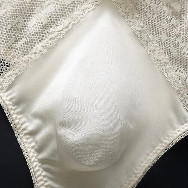Men's Thong Underwear Made of 81.7% Polyester 18.3% Spandex Ice Silk Blend with Lace Trim and 3D Bulge Pouch Solid G String