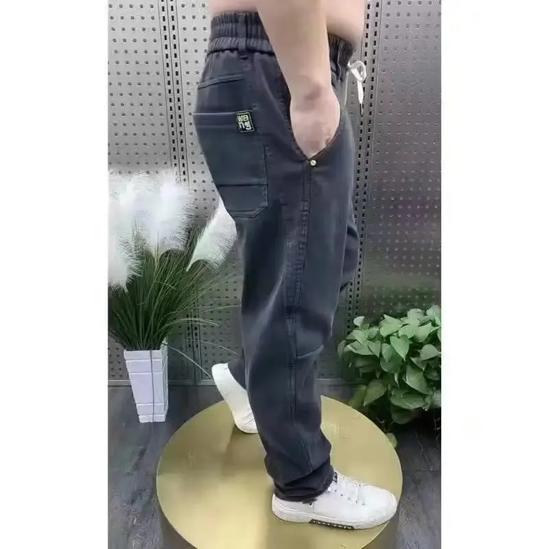 Harajuku Stretch Korea Streetwear רופף ג'ינס ג'ינס מוצק מותן אלסטי לגברים אביב קיץ חדש פלוס מידה 7XL 8XL מכנסיים מזדמנים