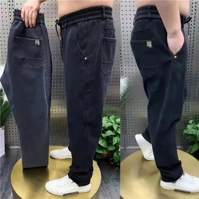 Harajuku Stretch Korea Streetwear רופף ג'ינס ג'ינס מוצק מותן אלסטי לגברים אביב קיץ חדש פלוס מידה 7XL 8XL מכנסיים מזדמנים