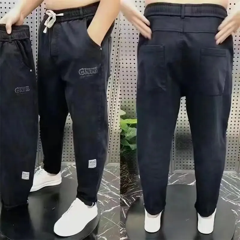 Harajuku Stretch Korea Streetwear רופף ג'ינס ג'ינס מוצק מותן אלסטי לגברים אביב קיץ חדש פלוס מידה 7XL 8XL מכנסיים מזדמנים